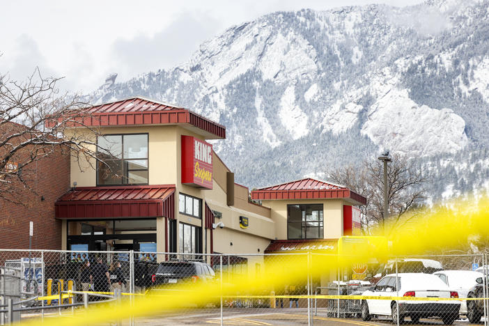 Crime tape surrounds a King Soopers grocery store on March 24 in Boulder, Colo where ten people were killed in a shooting on Monday. State Democrats now say they will consider a statewide assault weapons ban.