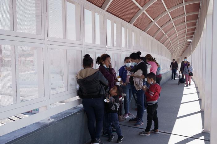 A group of migrants rapidly deported from the U.S. under Title 42 wait on the Mexican side of the Paso del Norte International Bridge, between El Paso, Texas and Ciudad Juarez, Mexico on March 10.