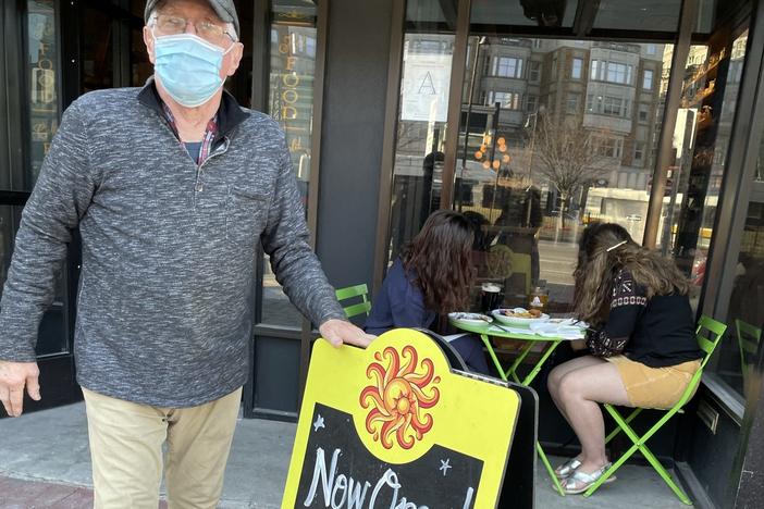 Cornwall's co-owner John Beale sets up sidewalk seating on the first day it's allowed in Boston. He and his wife Pam launched the English-style tavern nearly 40 years ago.