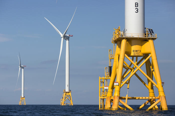 Three of Deepwater Wind's turbines stand off Block Island, R.I., in 2016. The Biden administration is pushing for a sharp increase in offshore wind energy development along the East Coast.