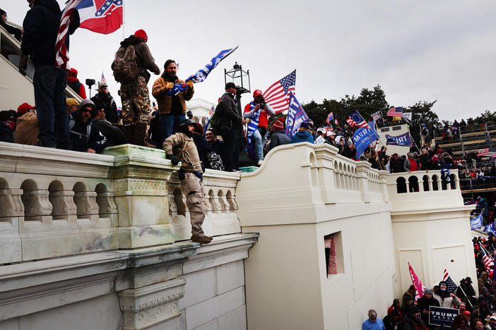 Thousands of supporters of former President Donald Trump storm the U.S. Capitol following a "Stop the Steal" rally on Jan. 6. Prosecutors are working on hundreds of charges related to the breach.
