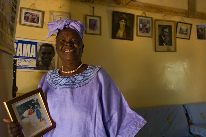 Sarah Obama holds a photograph of her grandson, Barack Obama in Kogelo, Kenya while awaiting the results of Super Tuesday's primary in Feb. 2008. She died on Monday after a brief illness, and is being remembered as a beloved matriarch and philanthropist.