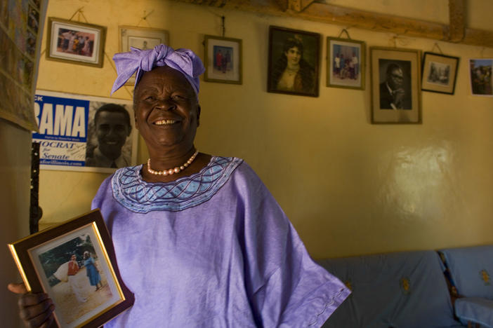 Sarah Obama holds a photograph of her grandson, Barack Obama in Kogelo, Kenya while awaiting the results of Super Tuesday's primary in Feb. 2008. She died on Monday after a brief illness, and is being remembered as a beloved matriarch and philanthropist.