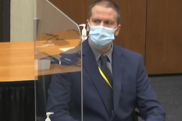 In this image from video, defense attorney Eric Nelson (left) and former Minneapolis police officer Derek Chauvin (right) listen during Tuesday's session at the Hennepin County Courthouse in Minneapolis, Minn. Chauvin is charged in the May 25, 2020 death of George Floyd.