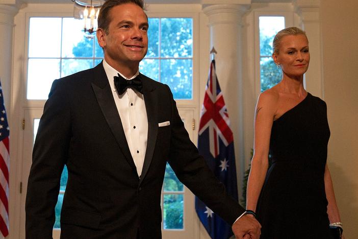 Fox Corp.'s Lachlan Murdoch and his wife, Sarah, arrive at the White House for a 2019 state dinner honoring Australian Prime Minister Scott Morrison. Murdoch and his family have left the U.S. for Sydney through at least the end of summer.