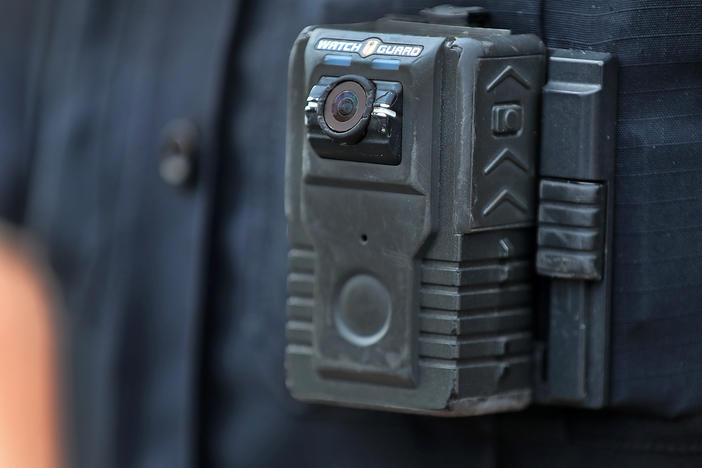 Police officer David Moore is pictured wearing a body camera in Ipswich, Mass., on Dec. 1, 2020. The city was among 25 statewide awarded grants to purchase body-worn cameras for videotaping interactions with the public. A new study says the benefits to society and police departments outweigh the costs of the cameras.