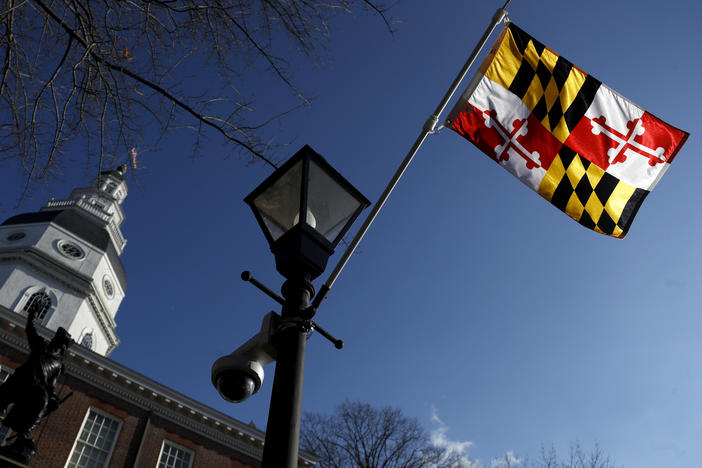 A Maryland state flag waves near the Statehouse in Annapolis. Maryland has decided to drop a state song that originated during the Civil War and alludes to Abraham Lincoln as a tyrant and a despot.