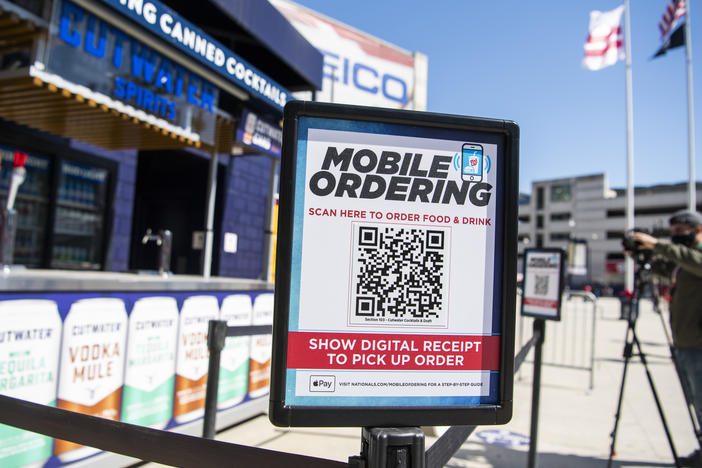 A mobile ordering sign is seen on March 30 at a vending station in Nationals Park, home of the Washington Nationals. The Nats, along with many other teams in baseball, are implementing new safety protocols, including for ordering food, as a new season kicks off on Thursday.