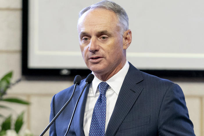 Major League Baseball Commissioner Rob Manfred, pictured in January, on Friday said the organization unwaveringly supports "fair access to voting."