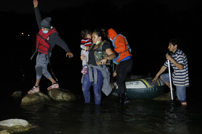 A group of migrants from El Salvador arrives in Roma, Texas, after crossing the Rio Grande on March 30, 2021 in Roma, Texas.