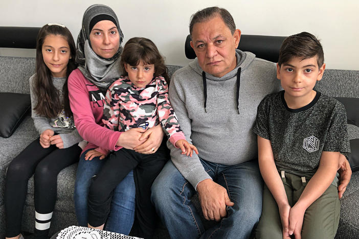 Heba Alrejleh and Radwan Jomaa with children Aya, 11, Lilian, 4, and Mohamed, 10. "The words 'to send us back to Syria' means to destroy our lives," says Jomaa.