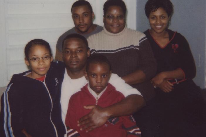 Shanaye Poole (left) next to her father, Toforest Johnson, during a family visit to see him in prison in the early 2000s.