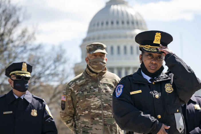 Acting U.S. Capitol Police Chief Yogananda Pittman (right) attends a press briefing about the attack Friday at the U.S. Capitol in Washington, D.C. Pittman announced that one Capitol Police officer died after a man rammed his vehicle into a barrier.