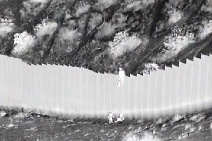 A Border Patrol agent operating a camera pointed at a section of the barrier just west of El Paso, Texas, spotted the two young girls, ages 3 and 5, as they were dropped from the top of the 14-foot wall.
