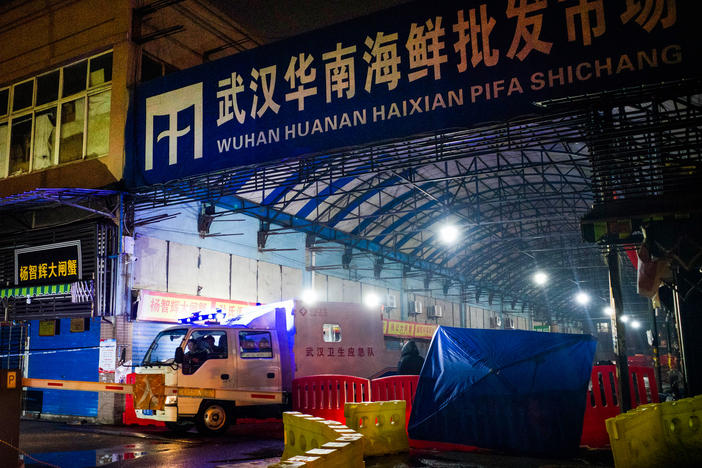 When COVID-19 first broke out in Wuhan, scientists tracked a large number of the cases to the Huanan Seafood Market in Wuhan. Above: The Wuhan Hygiene Emergency Response Team departs the market on Jan. 11, 2020, after it had been shut down to prevent the spread of the coronavirus.