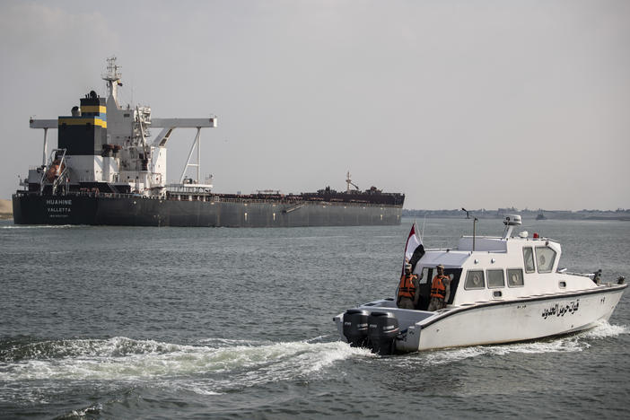 Traffic through the Suez Canal has returned to normal, the canal authority says. Here, the Huahine is seen crossing the canal on March 30 in Ismailia, Egypt.