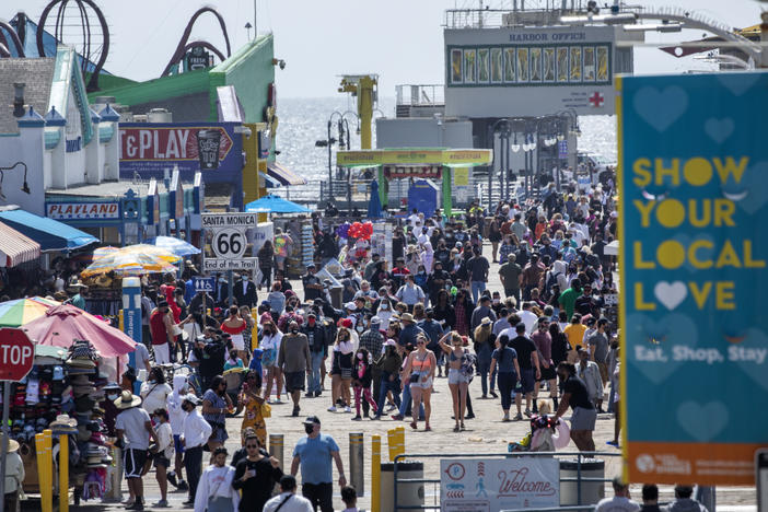 The Santa Monica Pier welcomed outdoor visitors on Monday as Los Angeles County entered the less-restrictive orange tier. The following day, California Gov. Gavin Newsom announced a target statewide reopening date of June 15, provided certain public health criteria are met.