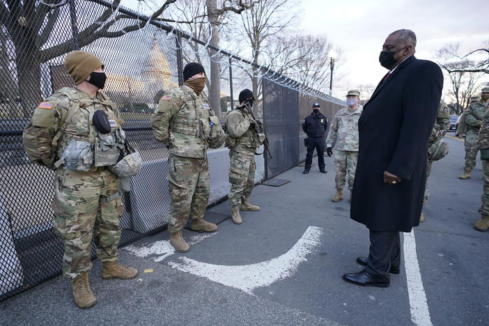 Defense Secretary Lloyd Austin visits National Guard troops deployed at the U.S. Capitol on Jan. 29. The troops were deployed in the wake of the Jan. 6 Capitol attack. Under Austin's order, all military units are holding "stand downs" to discuss extremism in the ranks.