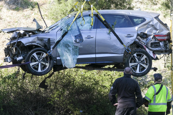 A crane is used to lift a vehicle driven by golfer Tiger Woods following a rollover accident in February in the Rancho Palos Verdes suburb of Los Angeles.