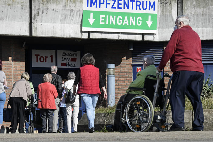 People wait in front of the vaccination center in Gelsenkirchen, Germany, Wednesday, last week. Germany's health minister says the country is exploring purchasing the Sputnik V COVID-19 vaccine from Russia.