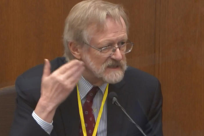 Dr. Martin Tobin testifies Thursday in the murder trial of former police officer Derek Chauvin. Tobin told jurors that the way George Floyd was restrained effectively shut down his left lung.