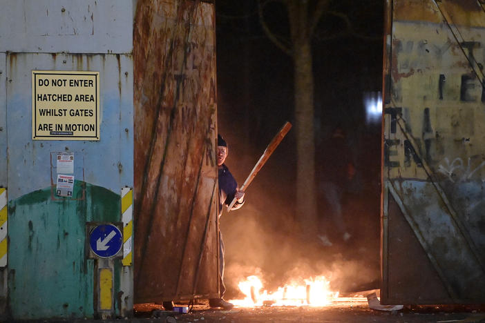Skirmishes erupt at the "peace wall" dividing Protestant and Catholic neighborhoods in Belfast, Northern Ireland, on Wednesday night.