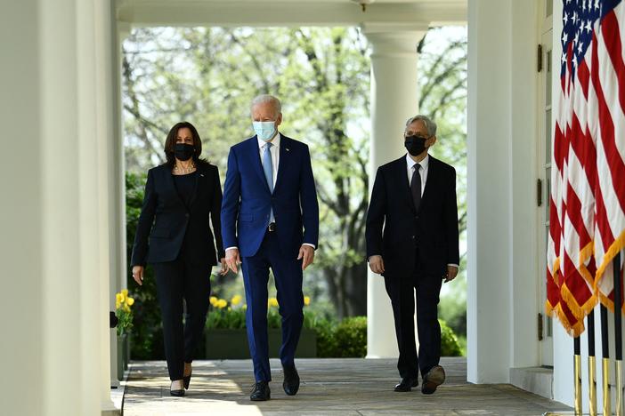 Vice President Harris, President Biden and Attorney General Merrick Garland arrive Thursday at the White House Rose Garden to speak about gun violence prevention.
