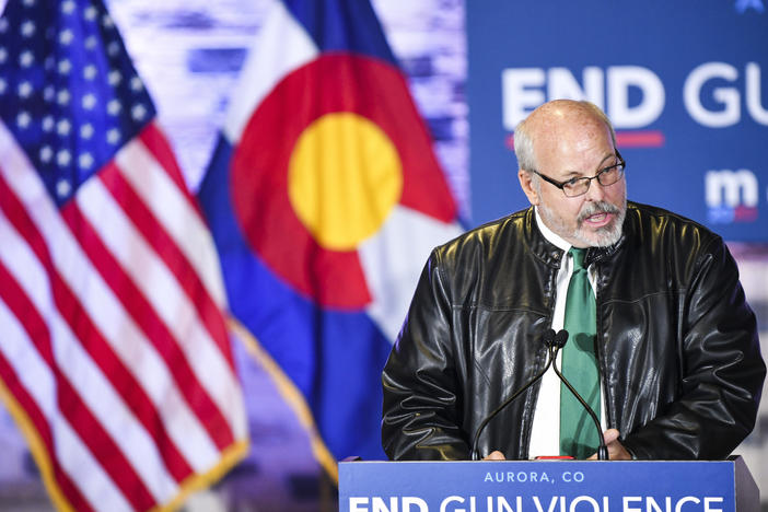 Colorado state Rep. Tom Sullivan, pictured here in 2019 introducing former Democratic presidential candidate Michael Bloomberg, says now is not the time to push for a statewide ban on assault-style weapons.