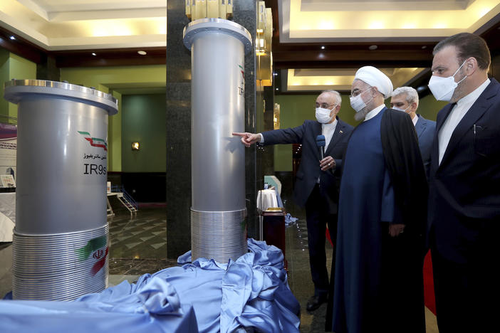 Iranian President Hassan Rouhani (second right) listens to head of the Atomic Energy Organization of Iran Ali Akbar Salehi while visiting an exhibition of Iran's new nuclear achievements in Tehran on Saturday.