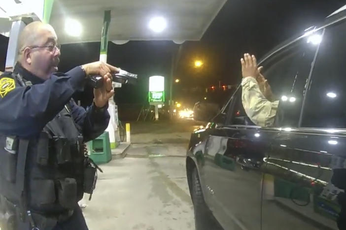 Officer Joe Gutierrez aims his weapon at Lt. Caron Nazario during a traffic stop. Nazario is suing Gutierrez and the other officer, Daniel Crocker, for violation of his constitutional rights.