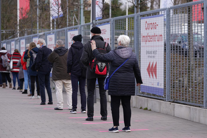 Lines form in front of a vaccination center Monday in Hamburg, Germany.