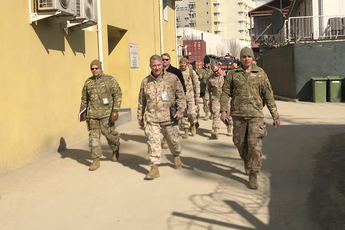 Marine Gen. Frank McKenzie (center) visits Kabul, Afghanistan, in January 2020. The Biden administration said it plans to complete a drawdown of U.S. troops in the country by Sept. 11.
