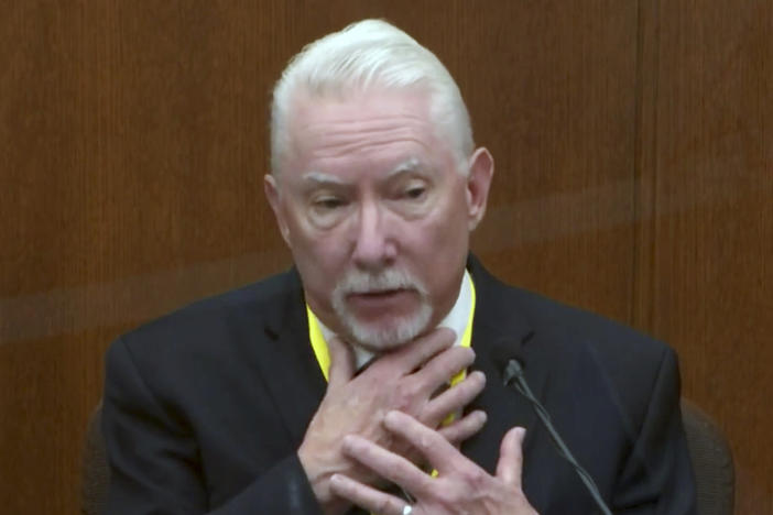 Barry Brodd, a use-of-force expert, testifies Tuesday in former Minneapolis police officer Derek Chauvin's trial. Brodd said the position in which George Floyd was restrained — facedown on the ground — was safest for officers and the suspect.