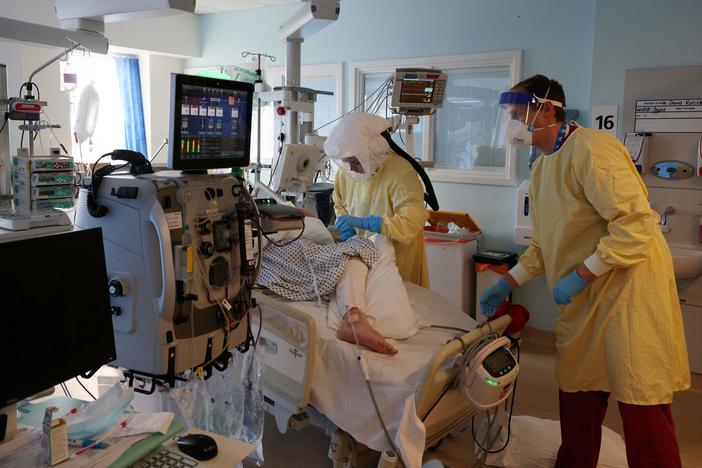Hospital workers tend to a Covid-19 patient at Queen Alexandra Hospital in Portsmouth, England, last month. Researchers have found that the so-called U.K. variant of the coronavirus isn't more likely to lead to death or severe illness.