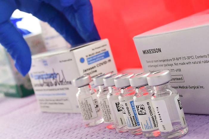 Bottles of the single-dose Johnson & Johnson Janssen COVID-19 vaccine await transfer into syringes for administering in March in Los Angeles. The CDC had called on Tuesday for a pause in administering the vaccine.