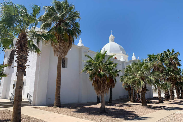 Ajo, a former copper mining town more than 100 miles from Phoenix, is unincorporated. The U.S. government began dropping off migrants on the historic plaza in Ajo in March.