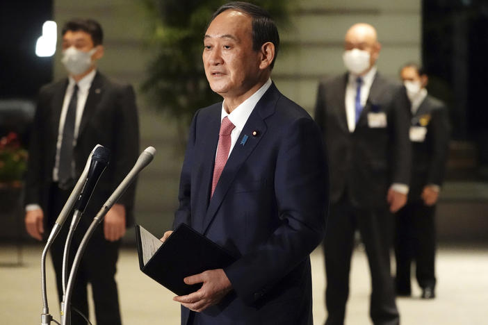 Japanese Prime Minister Yoshihide Suga speaks to media in Tokyo this month. Suga will take part in a Friday summit meeting with President Biden, the first foreign leader to meet the president face to face.