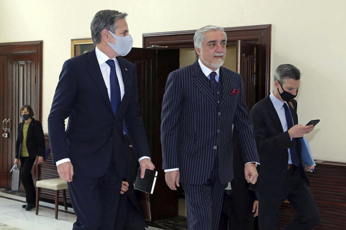 Abdullah Abdullah (center), chairman of the High Council for National Reconciliation, accompanies U.S. Secretary of State Antony Blinken at the Sapidar Palace in Kabul, Afghanistan, on Thursday.