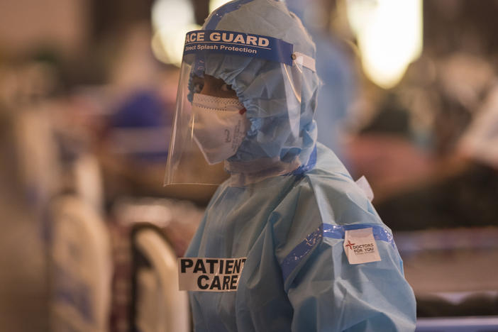 A medical worker is seen at a quarantine center for Covid-19 coronavirus infected patients at a banquet hall, which was converted into an isolation center to handle the rising cases of infection in New Delhi, India.