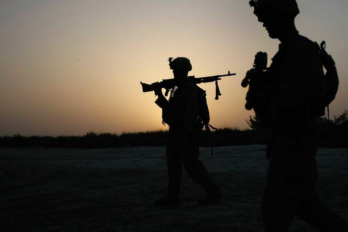 U.S. Marines conduct an operation to clear a village of Taliban fighters on July 5, 2009, in Mian Poshteh, Afghanistan. The U.S. and NATO forces plan to withdraw their remaining troops from Afghanistan by September.