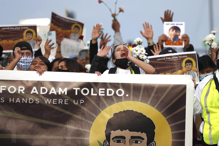 Demonstrators attend a peace walk on Sunday honoring the life of 13-year-old Adam Toledo in Chicago's Little Village neighborhood.
