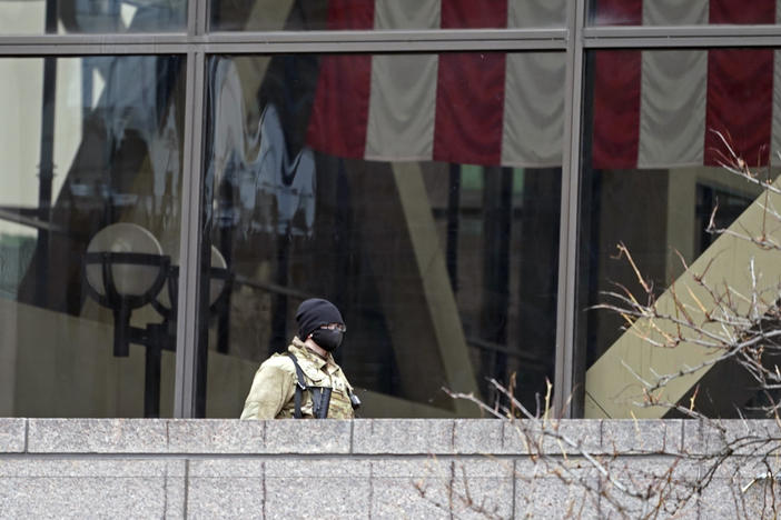 A National Guard soldier stands guard on an outside balcony last week at the Hennepin County Government Center in Minneapolis, where the trial of former police officer Derek Chauvin in the death of George Floyd continues.