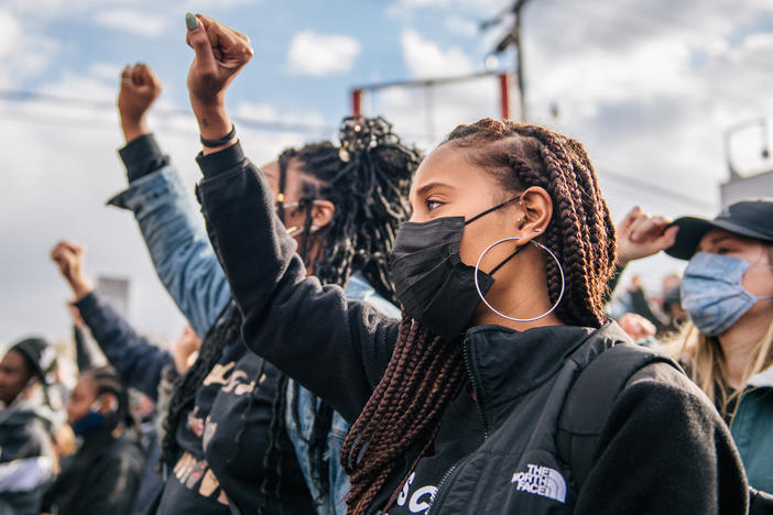 People gather at George Floyd Square in Minneapolis. On Tuesday, police officer Derek Chauvin was found guilty of two murder charges and one manslaughter charge in the death of George Floyd.