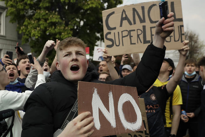 Chelsea fans protest outside Stamford Bridge stadium in London, against Chelsea's decision to be included amongst the clubs attempting to form a new European Super League.