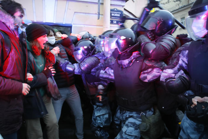 People clash with police during a protest in support of jailed opposition leader Alexei Navalny in St. Petersburg, Russia, Wednesday. A human rights group that monitors political repression said at least 1,700 people were arrested across the country in connection with the protests.