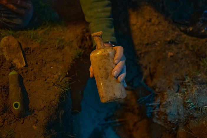 Researchers search for a bottle filled with seeds that was buried 142 years ago as part of a seed germination study.