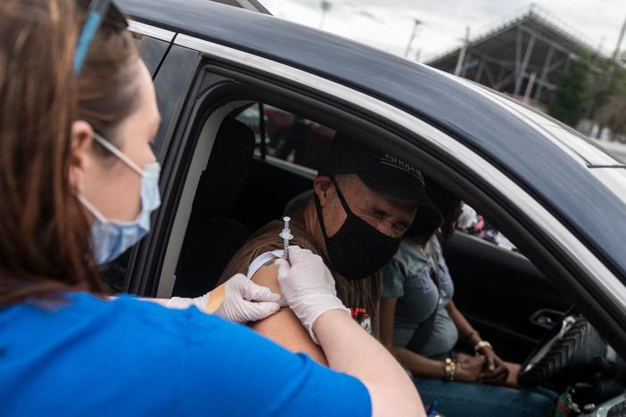 A nurse administers a COVID-19 vaccine in Ridgeway, Va., in March.