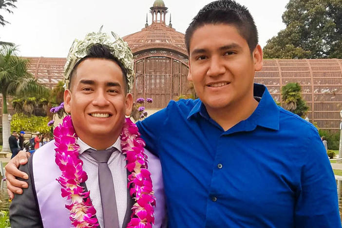 Angel, left, and Randy Villegas attend Angel's graduation ceremony in 2018 at the New School of Architecture & Design in San Diego, Calif.