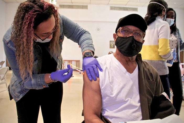 Thomas W. Munson receives his second dose of COVID-19 vaccination from registered nurse Elizabeth Lash at a Sayre Health clinic held at Tablenacle Lutheran Church in West Philadelphia.