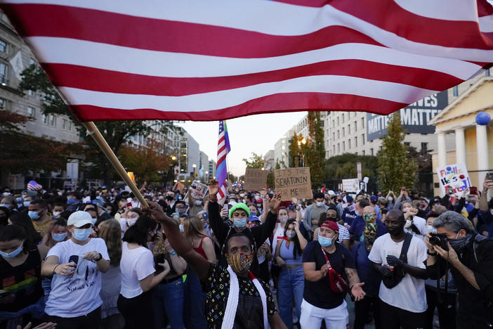 People gather in Black Lives Matter Plaza to celebrate president-elect Joe Biden's win over President Donald Trump on Nov. 7 in Washington, D.C. A new Harvard poll shows the youngest voting-age Americans are more politically active and optimistic about the future than four years ago.